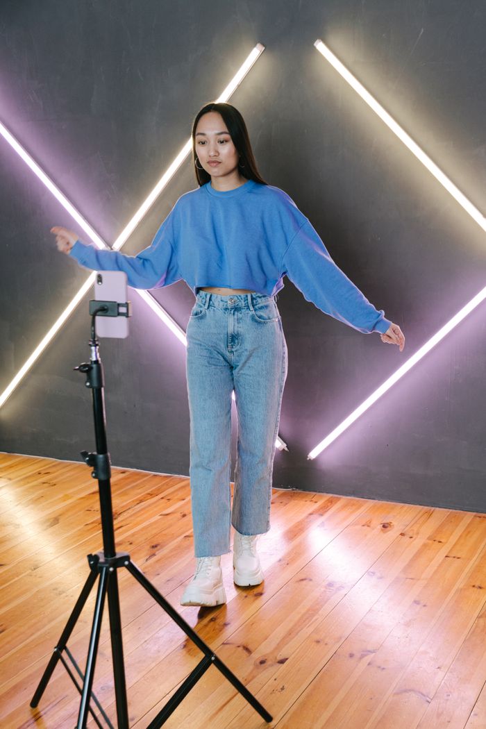 Young woman streaming a dance video