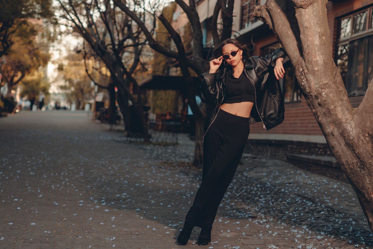 Stylish woman in black outfit